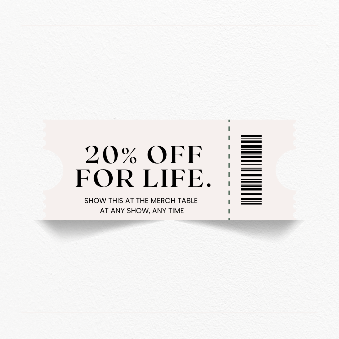 Promotional coupon with '20% off for life' at merch table